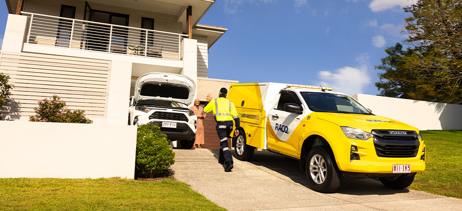Roadside patrol and vehicle in driveway helping member with car issue
