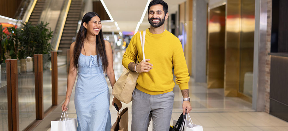couple-walking-in-shopping-centre