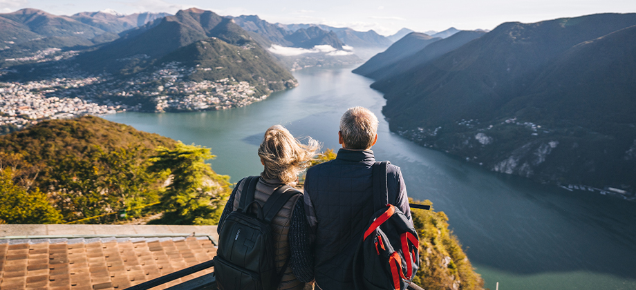 two travelers looking at mountains