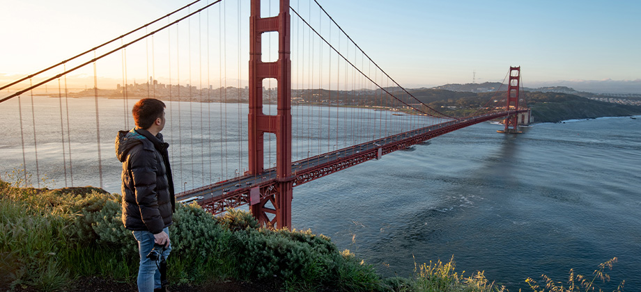 tourist enjoy looking at golden gate bridge during sunrise